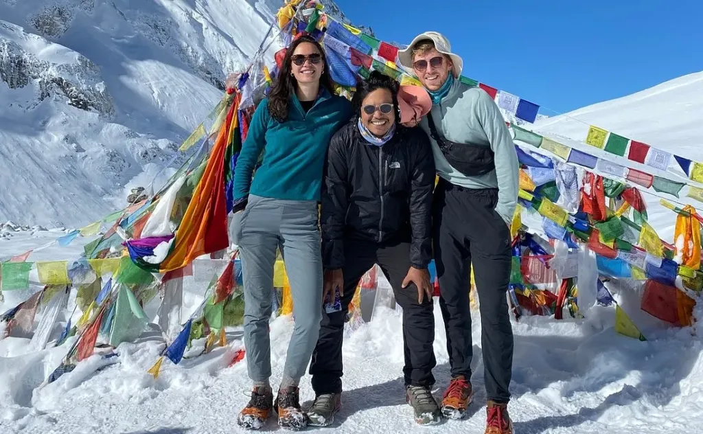 Trekkers from North Nepal Trek clicking photo at Larkya La Pass during Manaslu Circuit Trek.